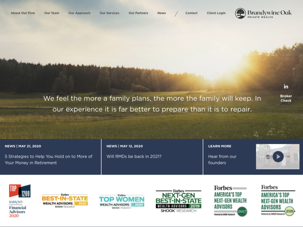 The updated homepage after scrolling down, slider text no longer obscured and accolades bar added